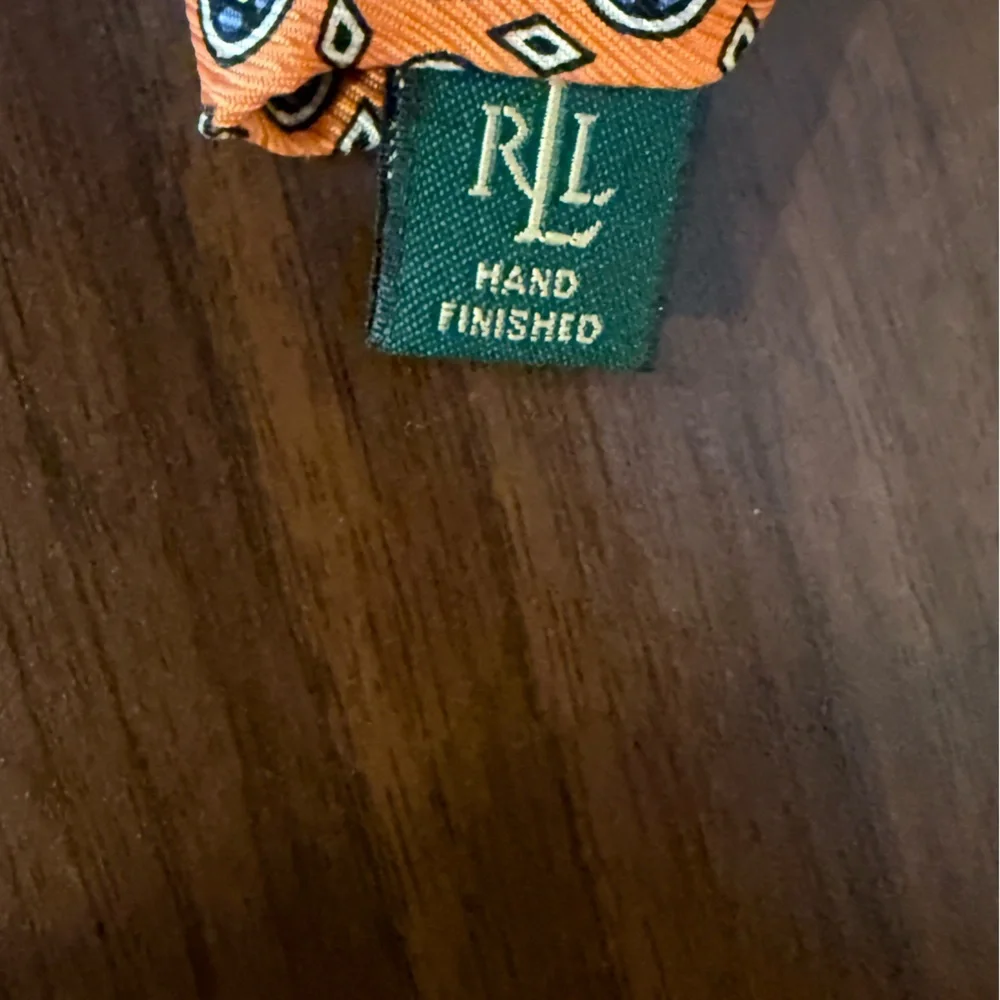 Lauren Ralph Lauren / orange 100% silk‎ necktie w circular blue pattern & dots